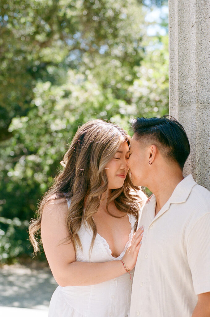 tender moment with engaged couple