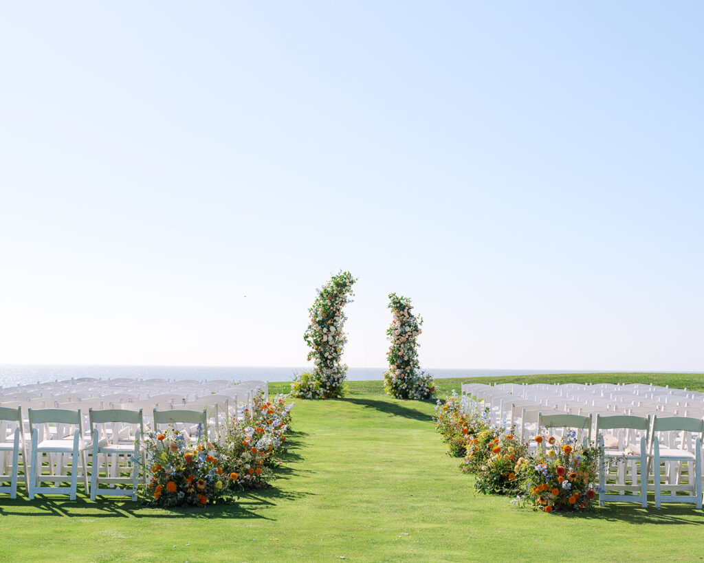 Half Moon Bay golf Links wedding wide ceremony views with stunning florals