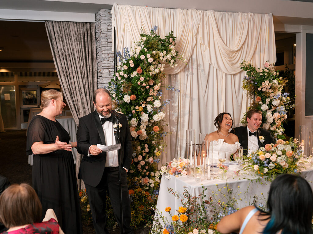 Parents give toast at wedding reception