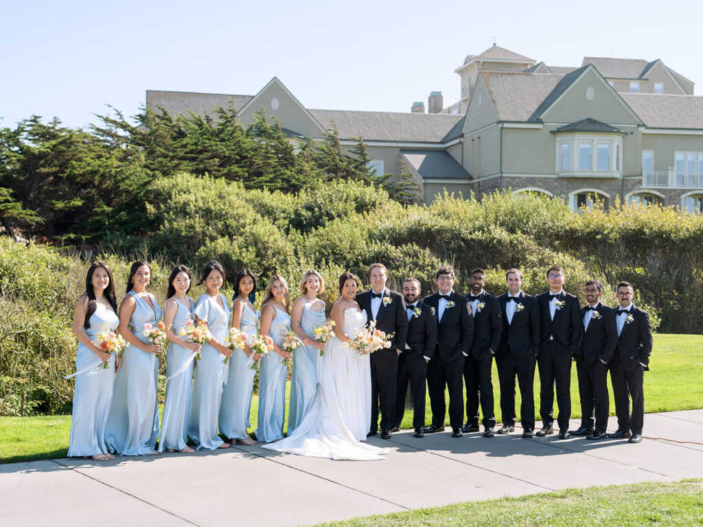 Pastel blue matching bridesmaid palette, in front of Half Moon Bay Golf Links wedding venue