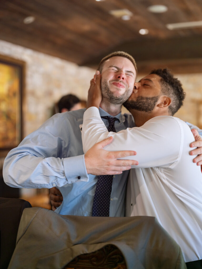 Groomsmen hanging out playfully, captured by documentary Carmel wedding photographer
