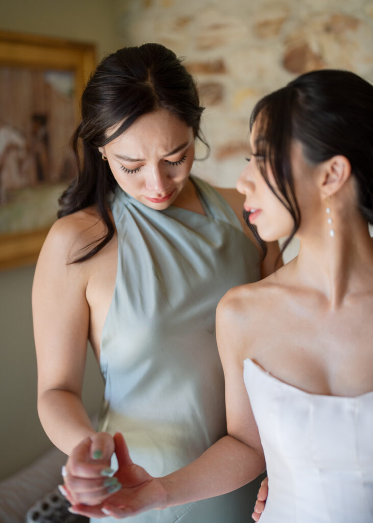 Emotional getting ready moments with the maid of honor, captured by San Francisco Bay Area wedding photographer