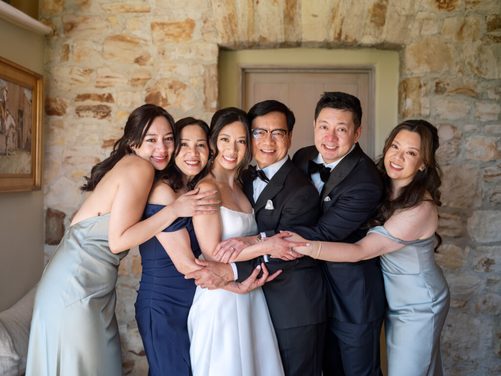 Joyful family photo with the bride