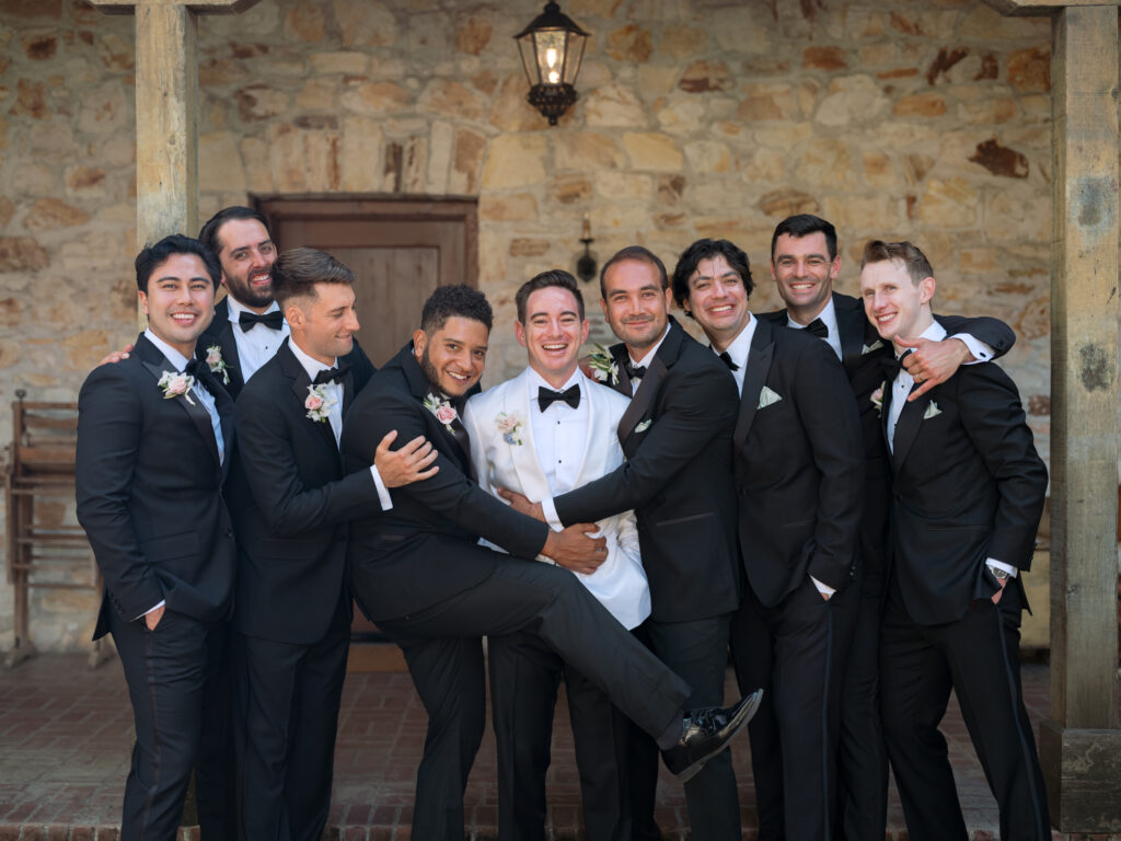 Groom with his fun groomsmen during Carmel wedding