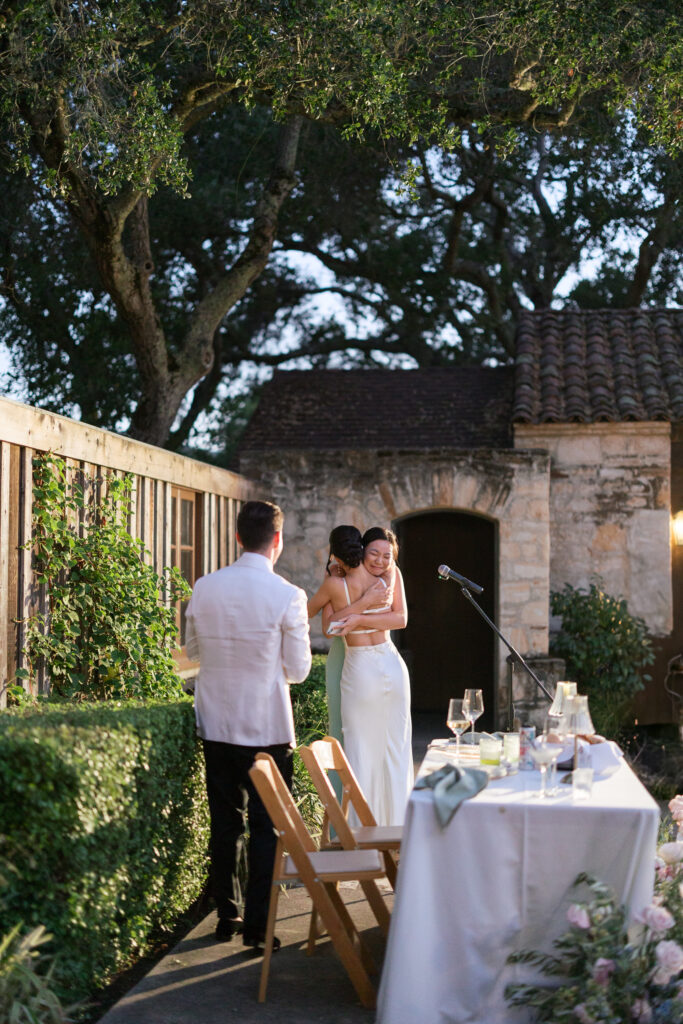 wedding reception on the rose patio, featuring emotional speeches