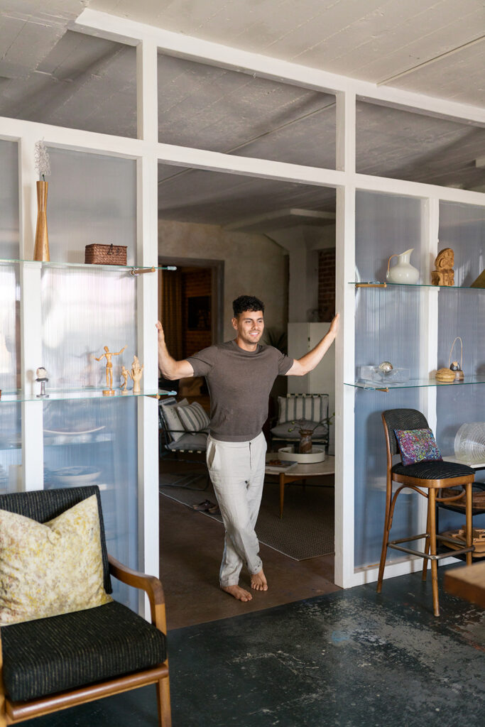 Portrait of groom to be in her apartment loft in lifestyle engagement session