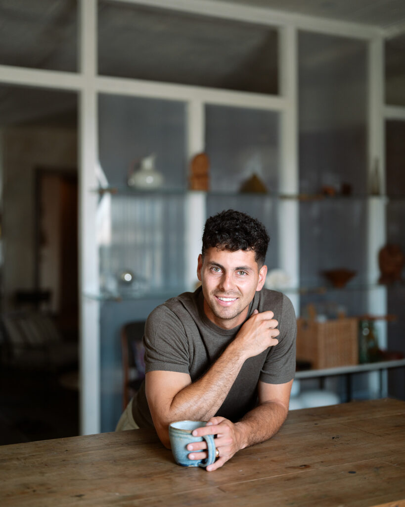 Groom to be close up lifestyle portrait posing at kitchen table in a loft in the san francisco bay area