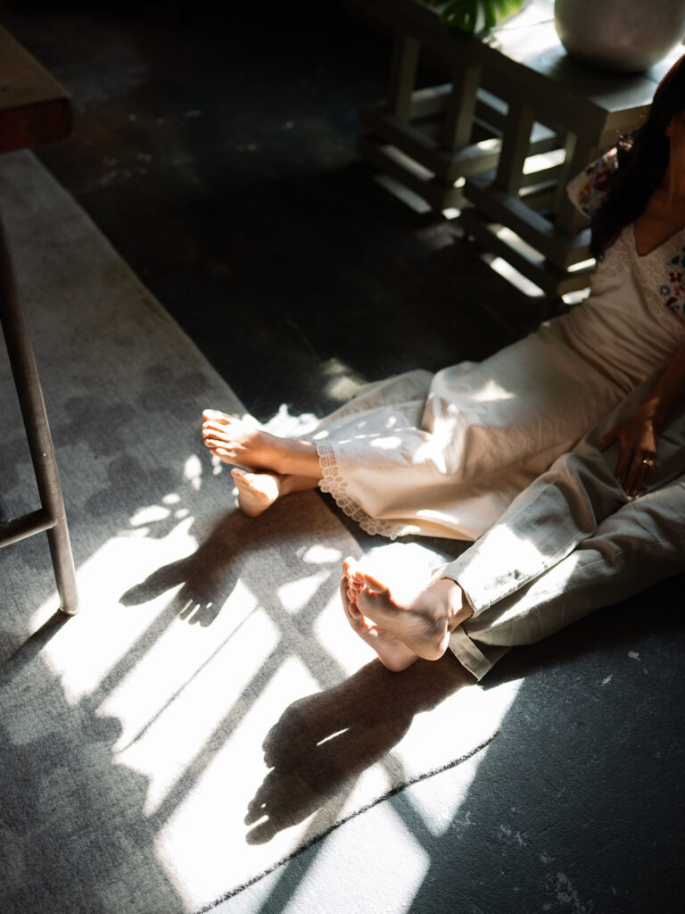 Photos of engaged couple and just their feet in the window light, a creative portrait in studio