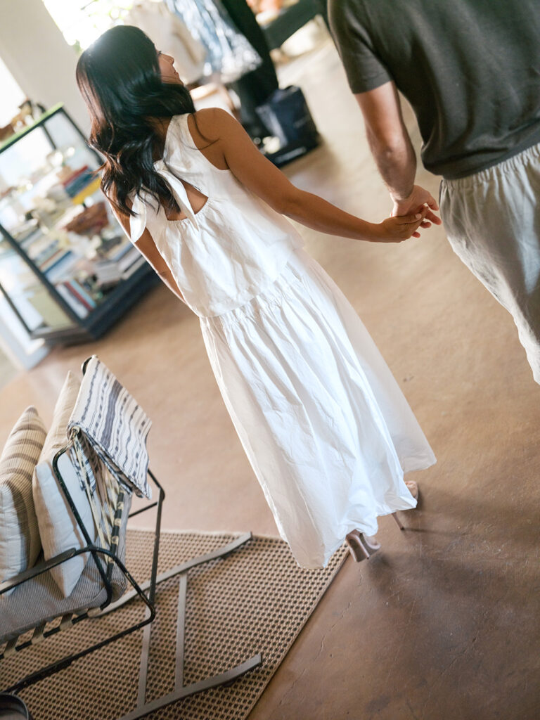 Engaged couple head out of their loft studio for their downtown engagement photos