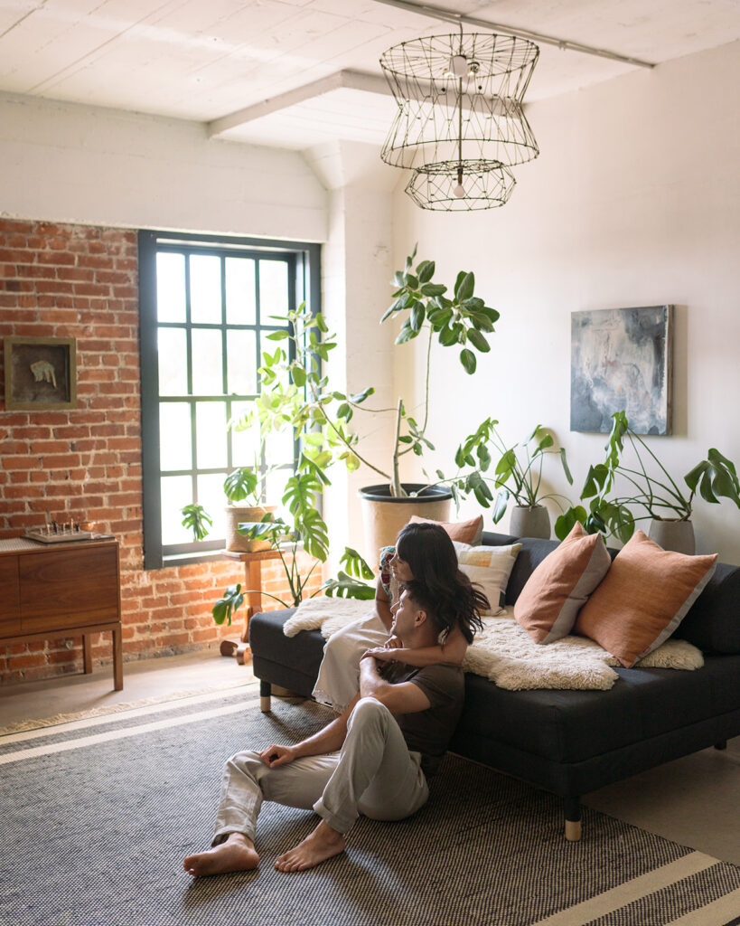 Newly engaged couple lounge for a studio lifestyle engagement session in the San Francisco Bay Area