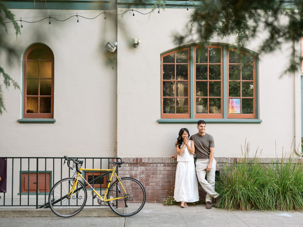Kelli and Frank pose in downtown Oakland for their engagement photos