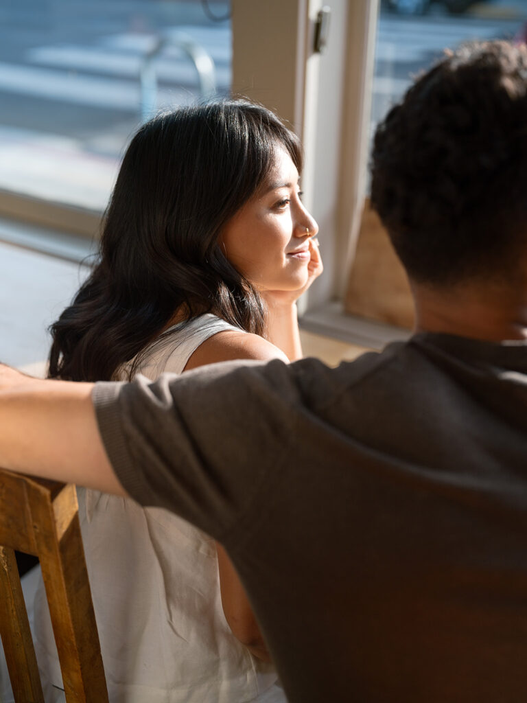 Kelli and Frank wrap up their downtown lifestyle engagement photos at their favorite cafe in Oakland