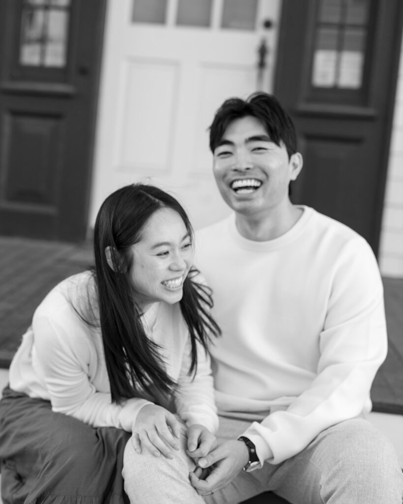 Couple laughing together during golden hour engagement photos at San Francisco Presidio