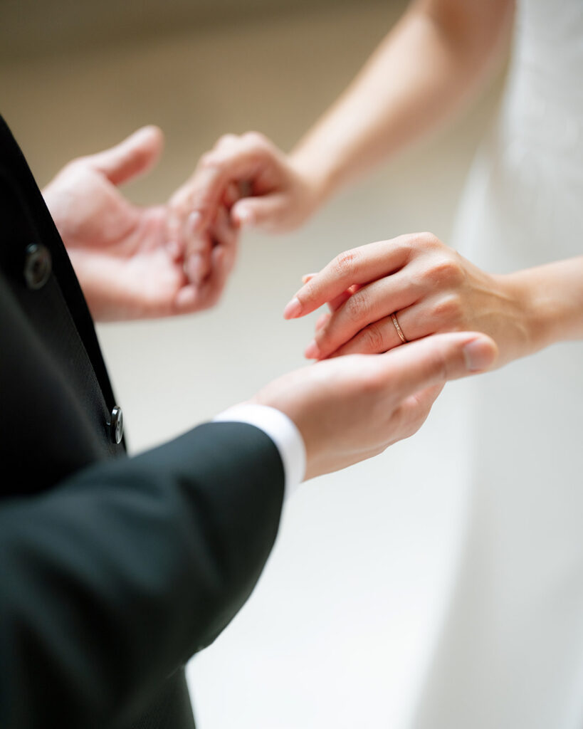 close up of bride and groom's wedding bands at San Francisco City Hall
