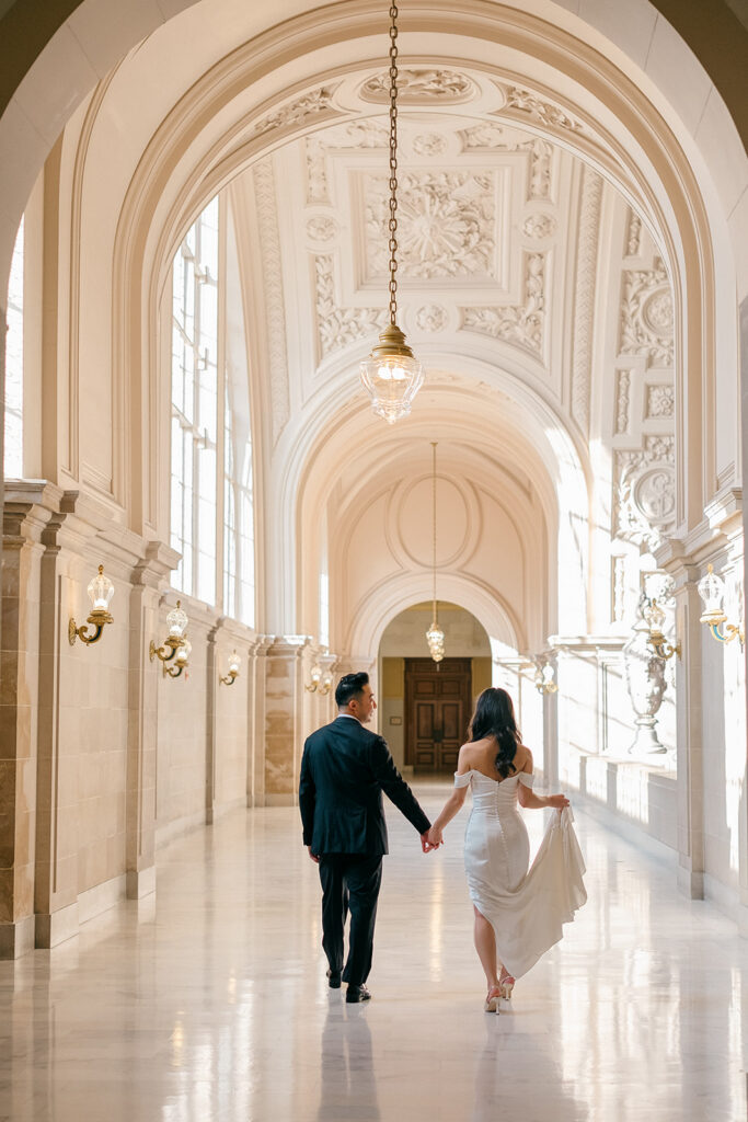 Wide shot of bride and groom on the grand staircase